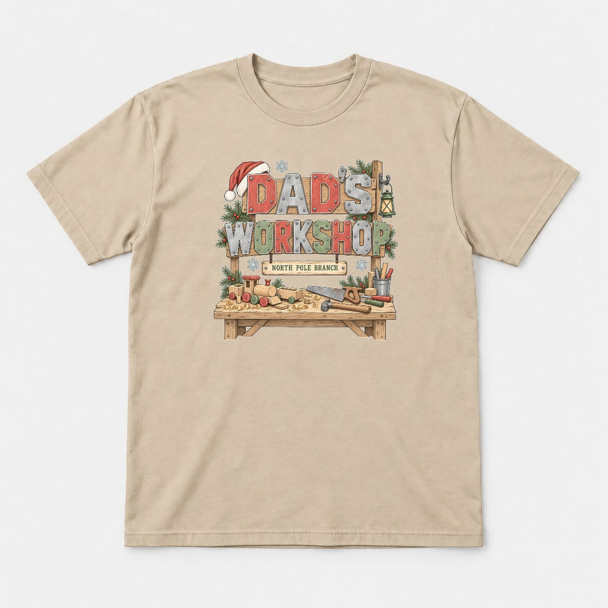 Dad's Workshop North Pole Branch Christmas Graphic T-Shirt & Sweatshirt - Tshirt Sand Front