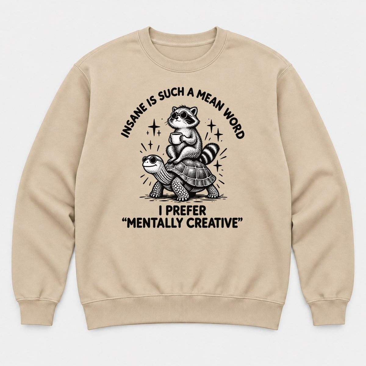 Insane Is Such a Mean Word Mentally Creative Raccoon on Turtle Graphic T-Shirt & Sweatshirt - Sweatshirt Sand Front