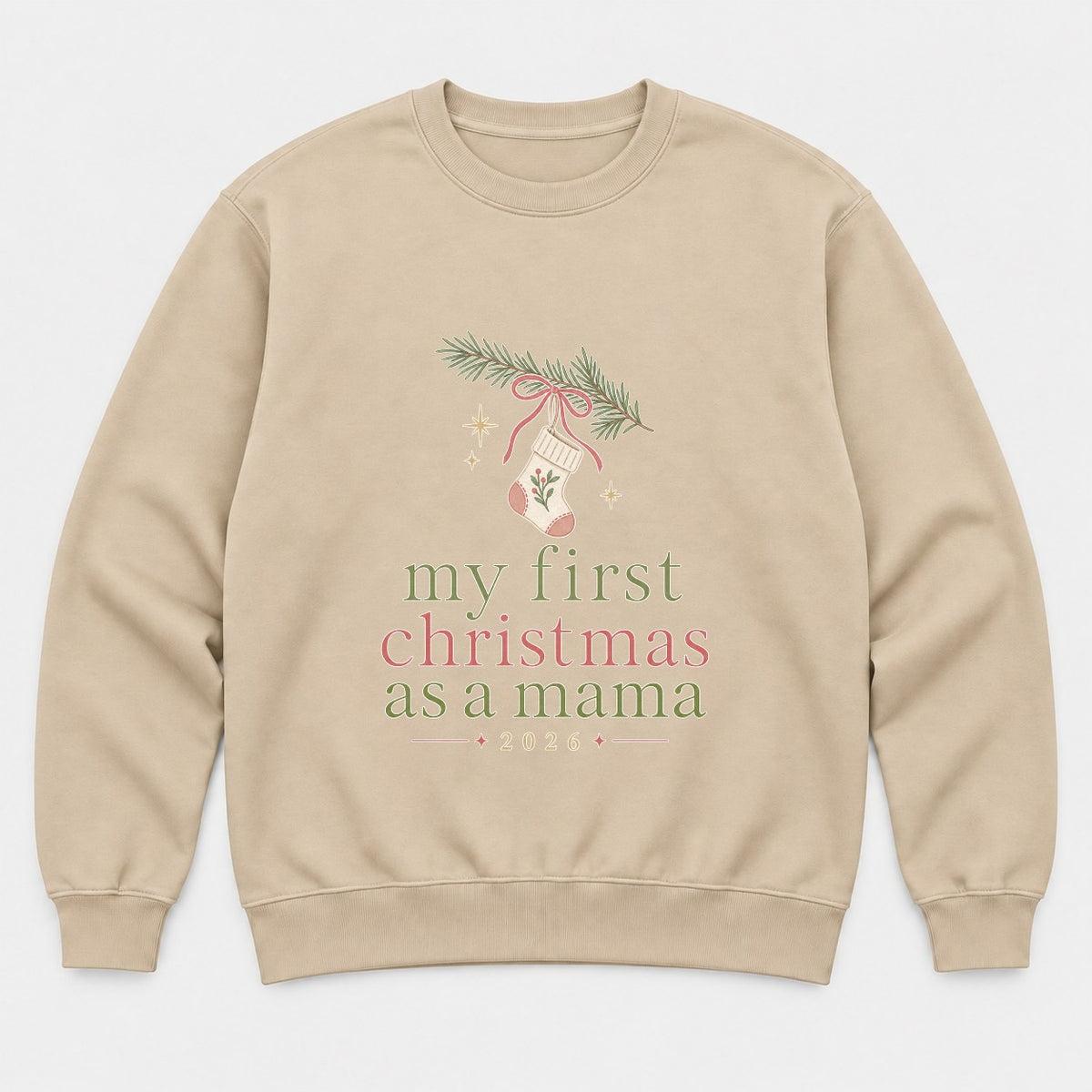 My First Christmas As A Mama 2026 Stocking Graphic T-Shirt & Sweatshirt - Sweatshirt Sand Front