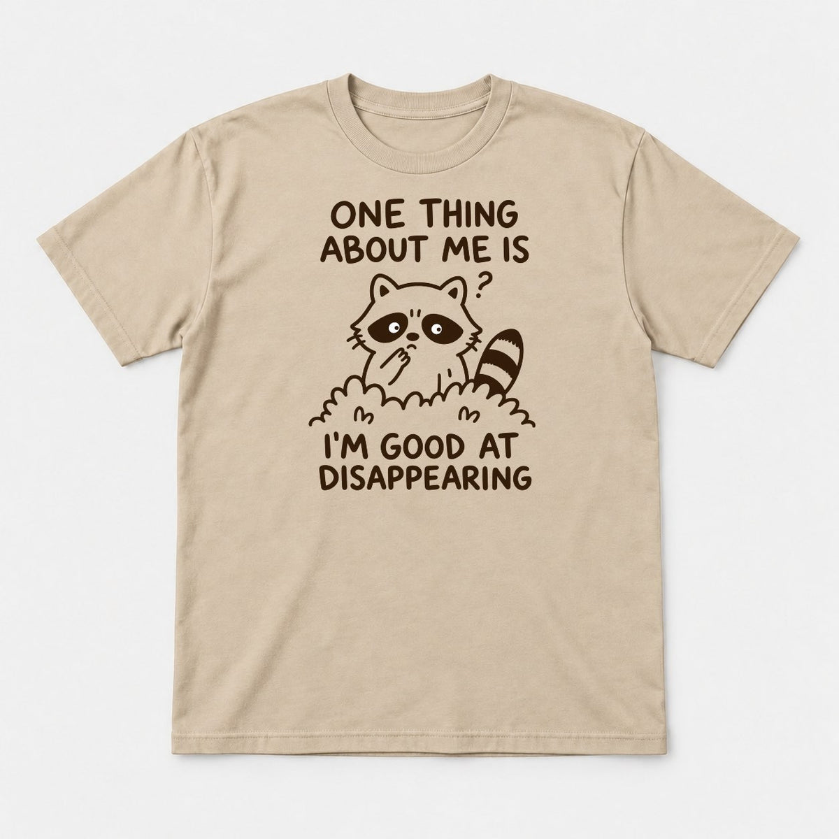One Thing About Me Is I'm Good At Disappearing Funny Raccoon Graphic T-Shirt & Sweatshirt - Tshirt Sand Front