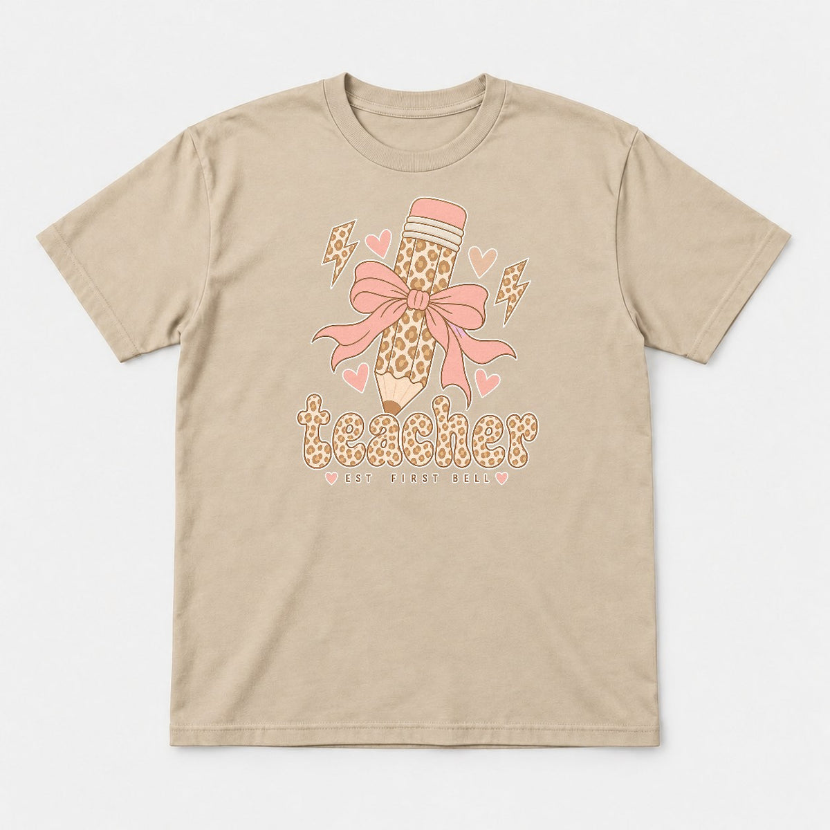 Teacher Est First Bell Leopard Pencil Coquette Bow Graphic T-Shirt & Sweatshirt - Tshirt Sand Front