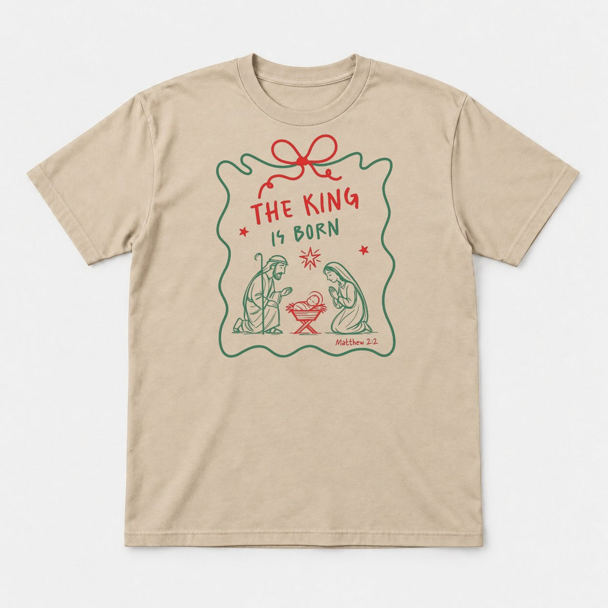 The King Is Born Nativity Scene Christmas Graphic T-Shirt & Sweatshirt - Tshirt Sand Front